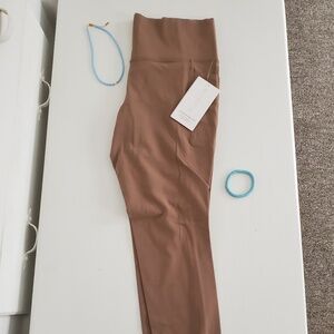 NWT Athleta brown Salutation Stash Tight Leggings, Size L